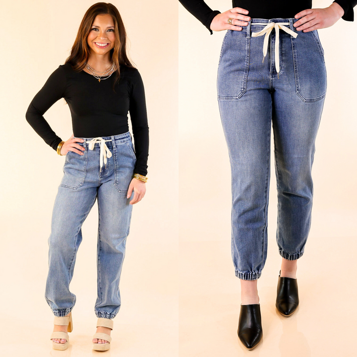 High-quality denim in a versatile medium wash, these denim joggers feature a drawstring waist and a cinched hem. Size 0 to 15 & 14W to 24W.