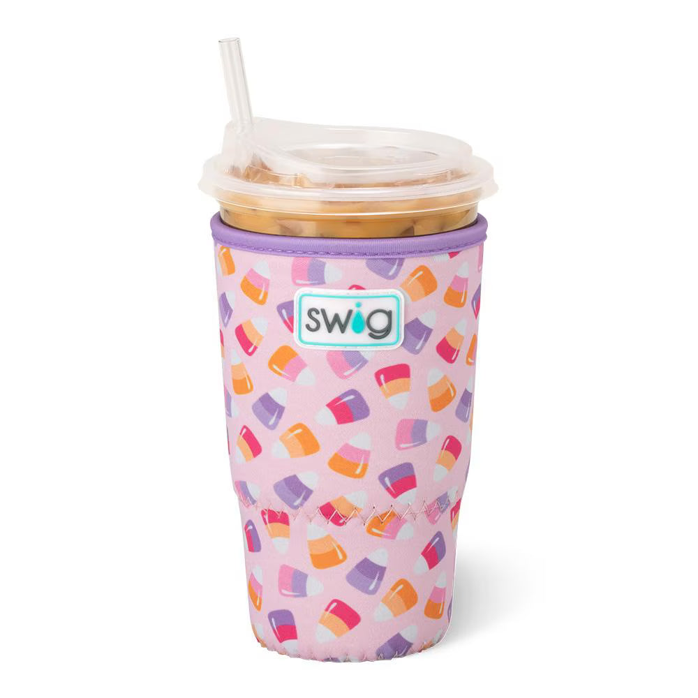 Pink coolie with candy corn colorful pattern and straw, featuring the Swig brand logo.