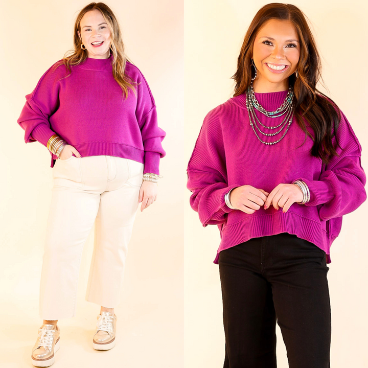 Two models wearing the Plum Purple 'Fireside Fit' cropped long sleeve mock neck sweater with jeans. Against a plain background.
