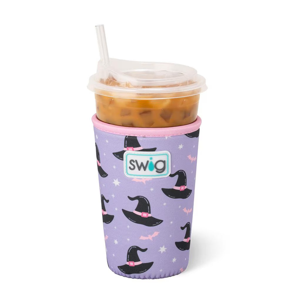 Swig cup with purple sleeve featuring witch hats on a white background