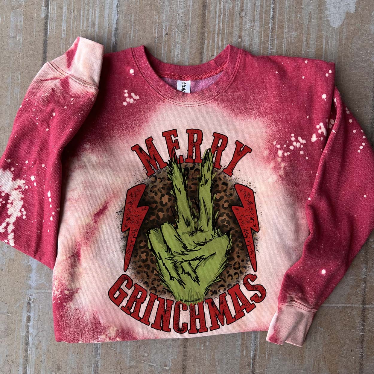 Online Exclusive | Merry Grinchmas Long Sleeve Bleached Splatter Graphic Sweatshirt in Red - Giddy Up Glamour Boutique