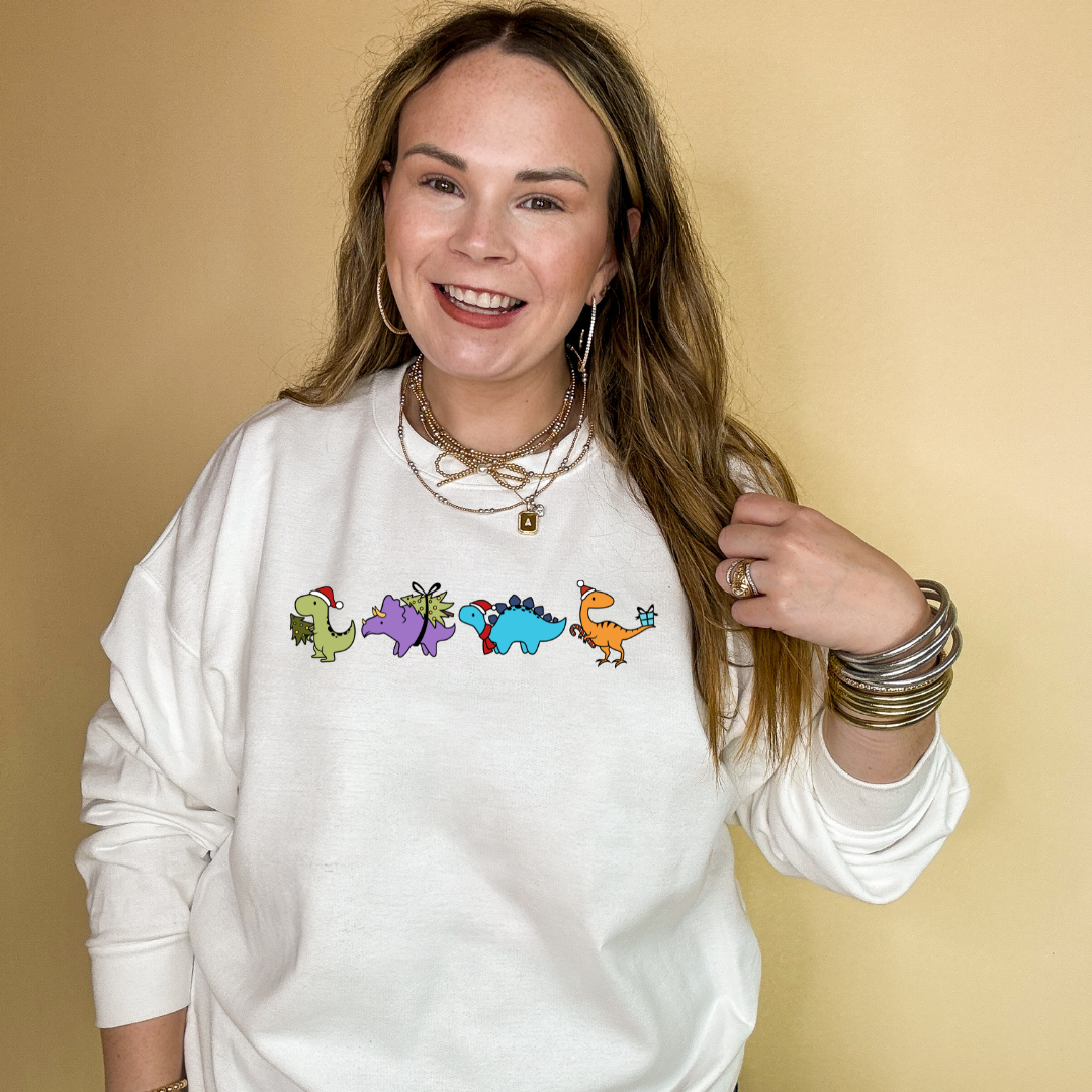 Online Exclusive | Holiday Dinosaur Parade Graphic Sweatshirt in Multiple Color Options