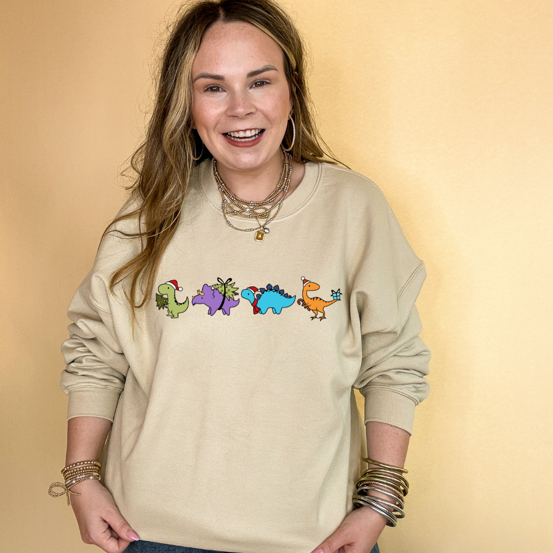 Online Exclusive | Holiday Dinosaur Parade Graphic Sweatshirt in Multiple Color Options