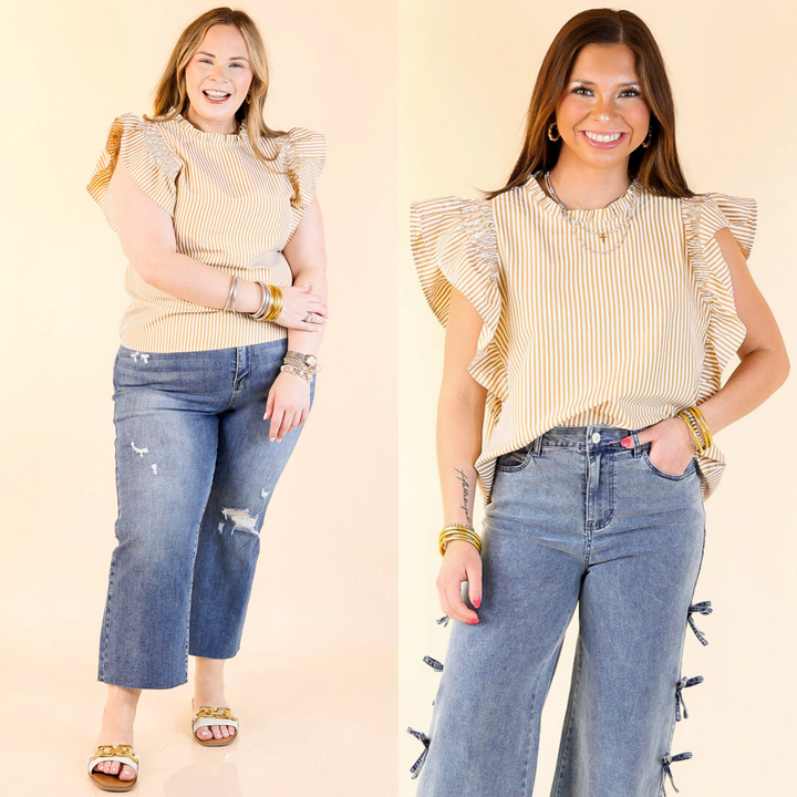 This top includes ruffle cap sleeves, a ruffle neckline, and a pin striped body. Available in sizes small through plus size. 