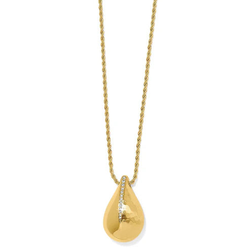 Solid white background. A gold chain necklace with a teardrop shaped pendant on the end and a line of diamonds halfway down the center.