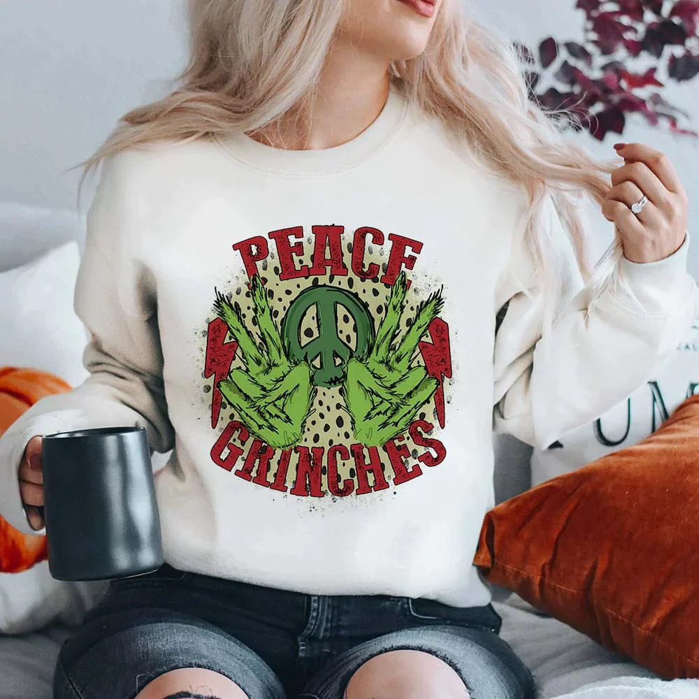 Online Exclusive | Peace Grinches Long Sleeve Graphic Fleece Sweatshirt in White - Giddy Up Glamour Boutique