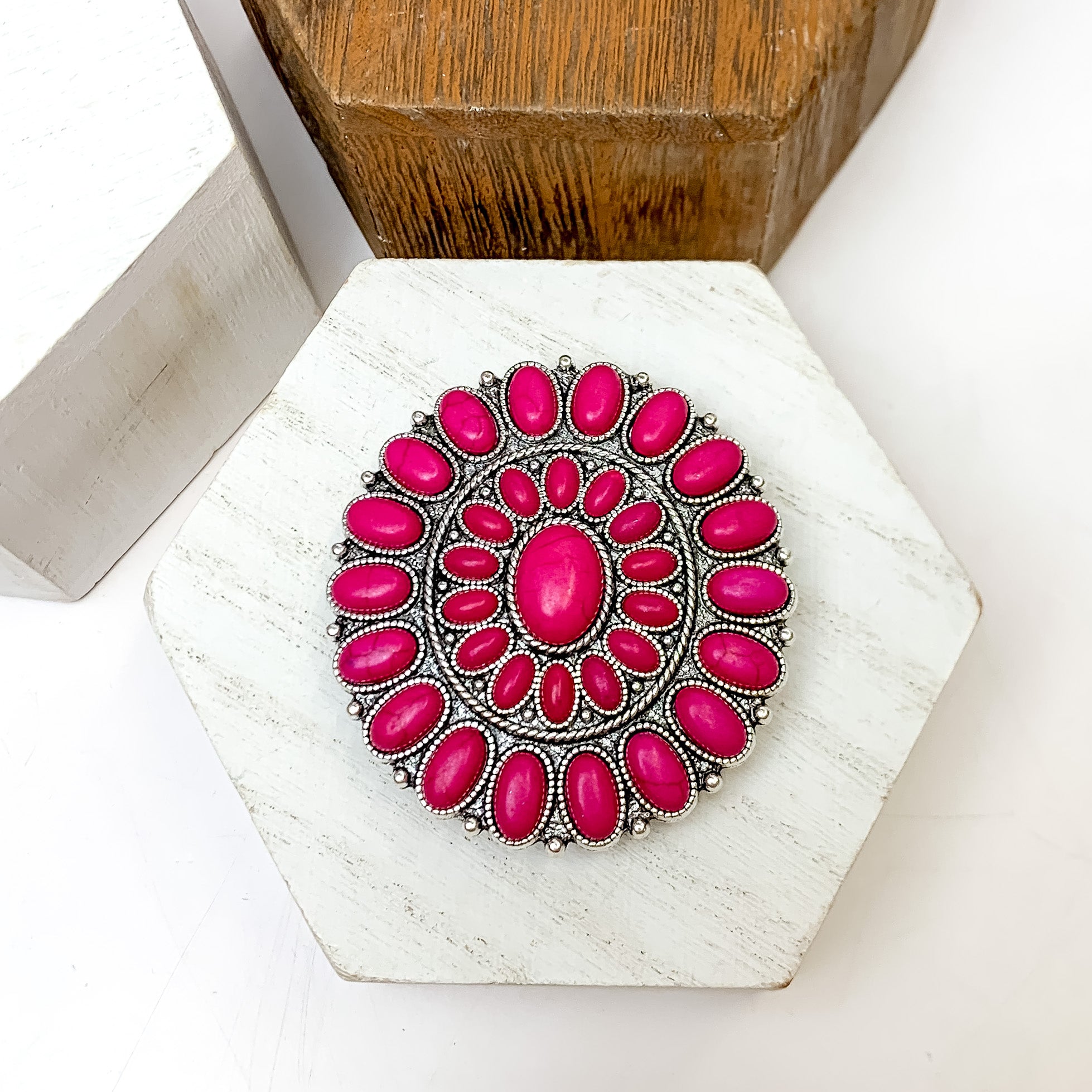 Silver Tone With Fuchsia Stones Circle Phone Grip. This phone grip is pictured on a white block with a white background behind it.