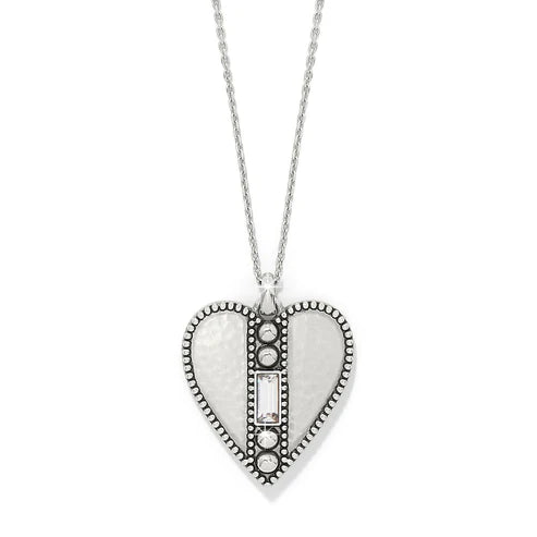 A heart pendant necklace in silver with a center stone on a white background.