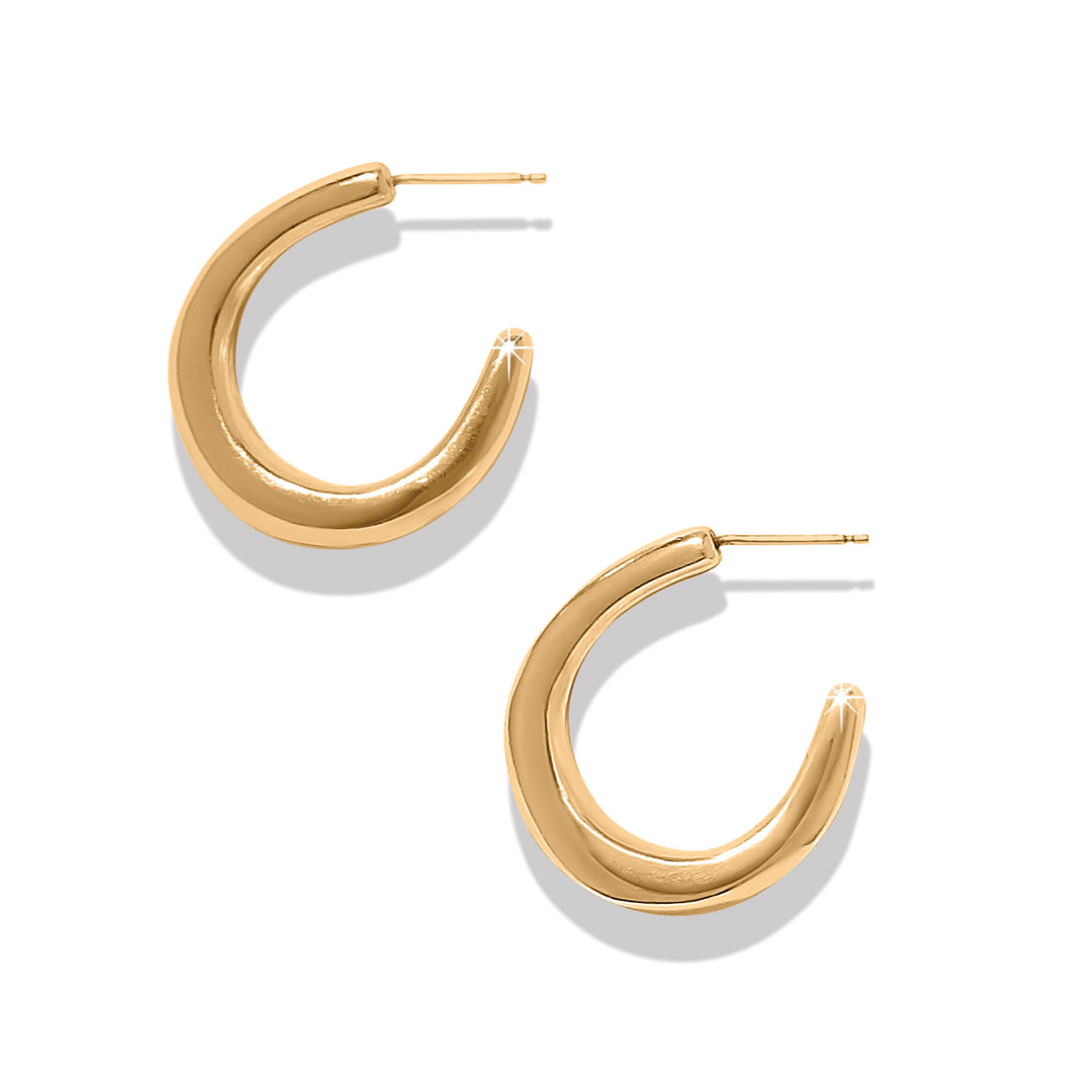 Gold hoop earrings on a white background