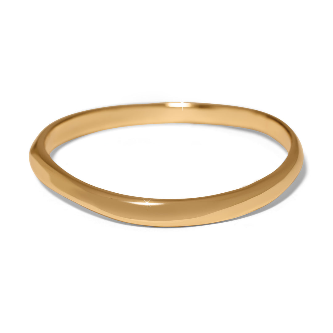 Gold bangle on a white background