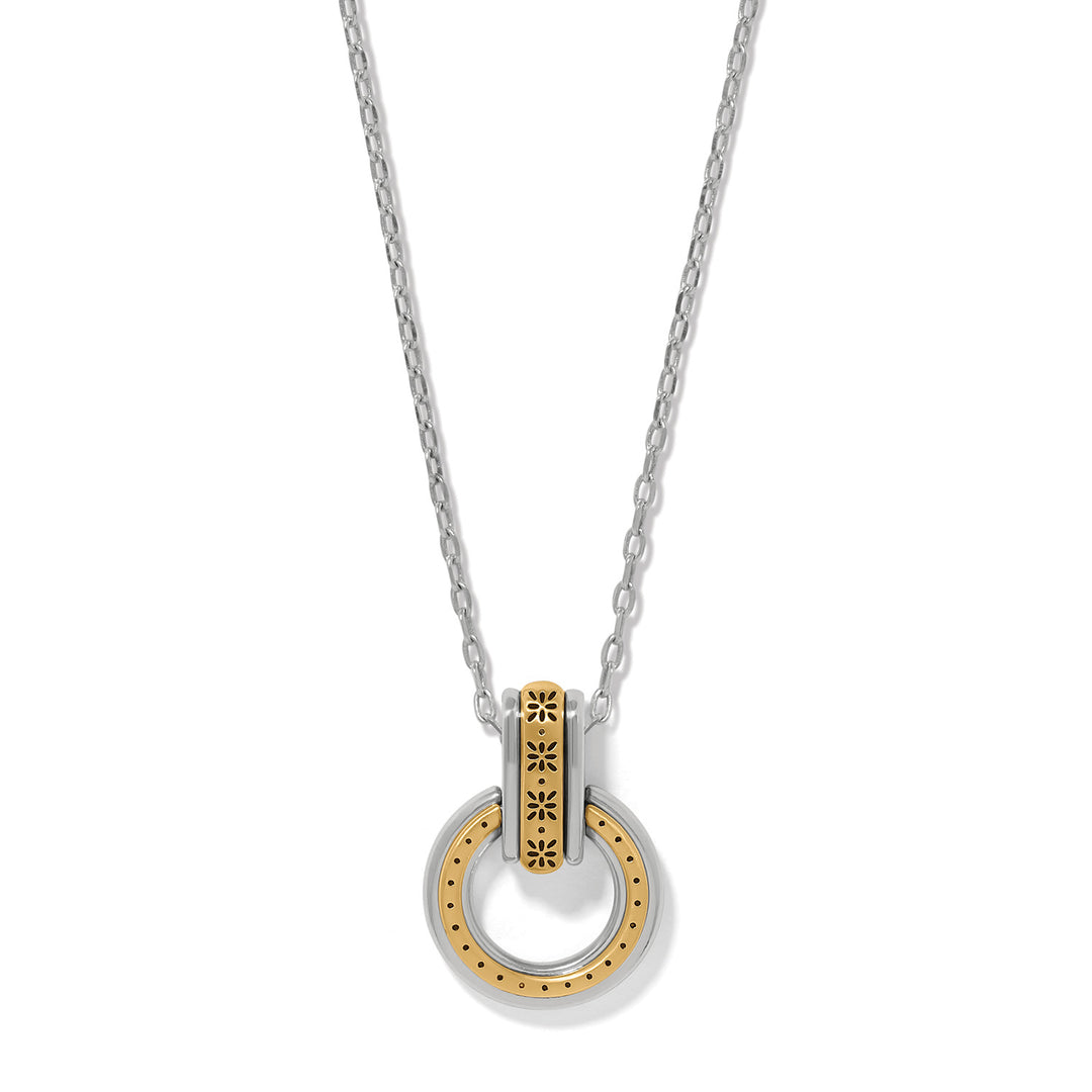 Necklace with a gold and silver pendant on a white background