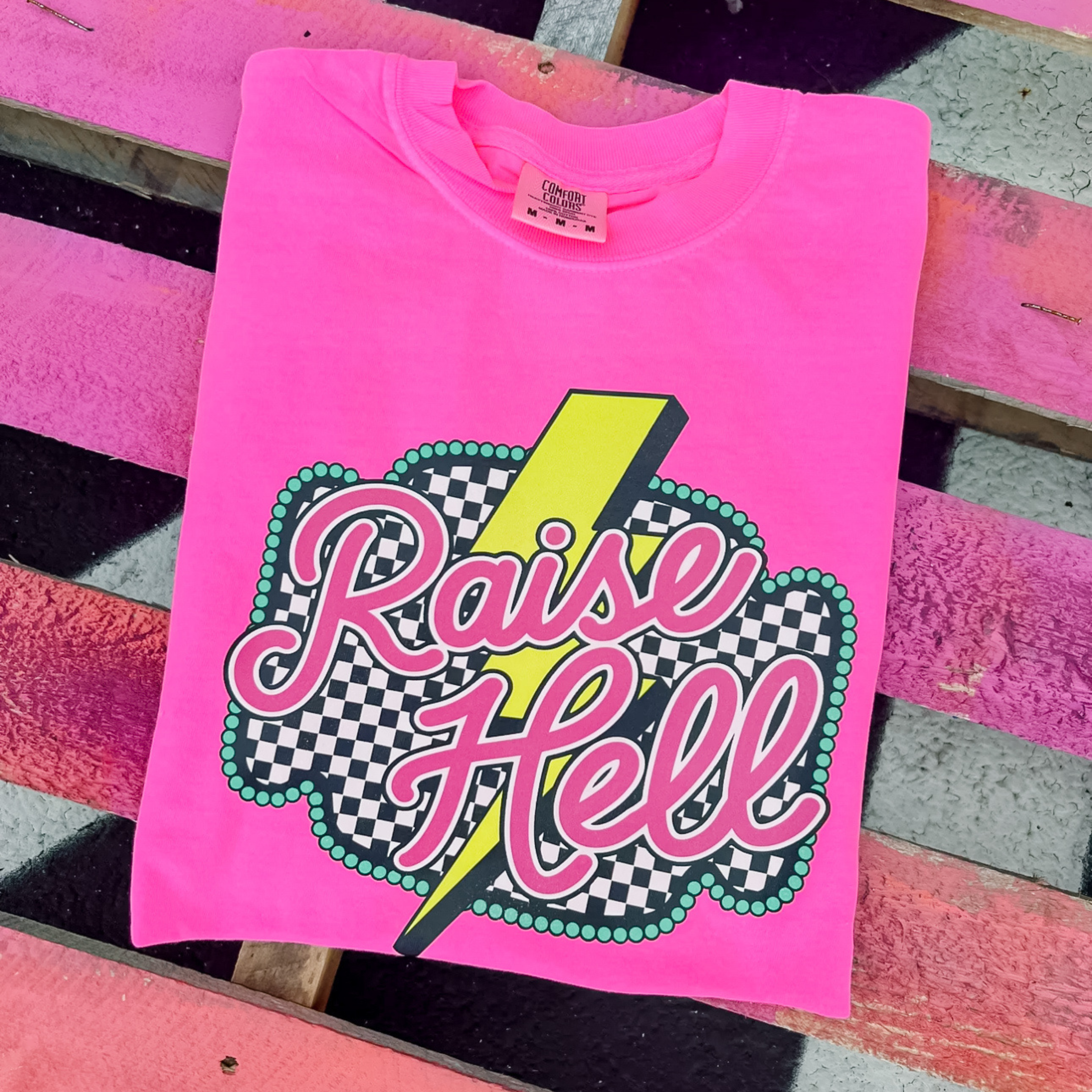 Online Exclusive | Checkered Raise Hell Short Sleeve Graphic Tee in Hot Pink - Giddy Up Glamour Boutique