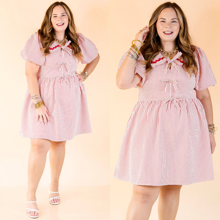 Short red and white striped babydoll dress with three bows down the front and a peter pan collar with rickrack detailing. 