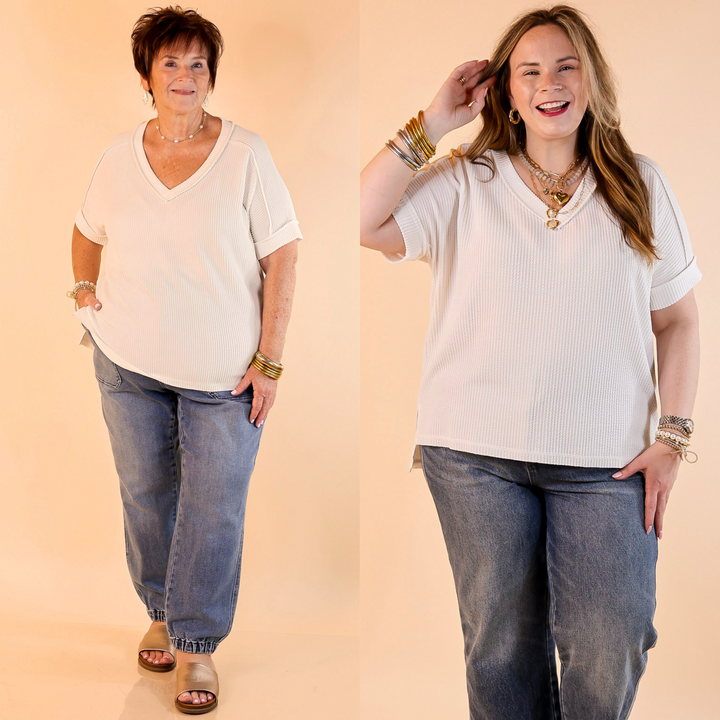 Designed with a flattering V-neck, ribbed texture, short sleeves, and a slight high-low hemline. 