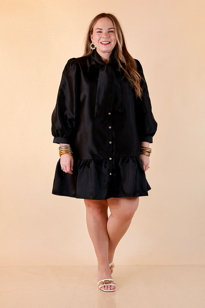 Sealed With a Bow Tie Neck Long Sleeve Button Front Dress with Ruffle Hem in Black