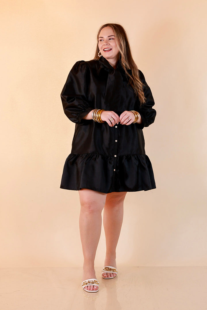 Sealed With a Bow Tie Neck Long Sleeve Button Front Dress with Ruffle Hem in Black