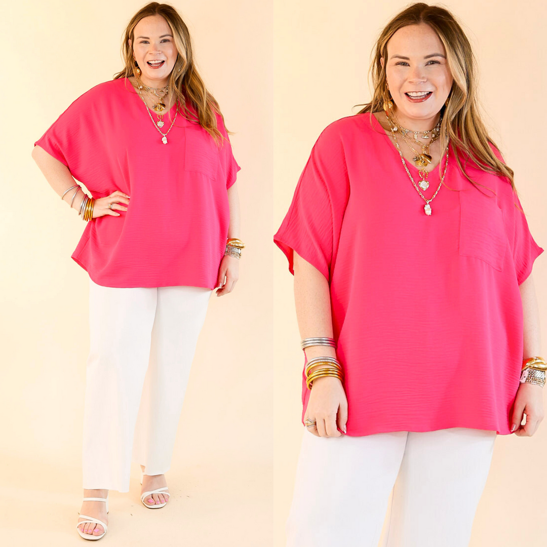 This cute top includes short drop sleeves, a v neckline, a front pocket, and an oversized fit. Available in sizes small through plus size. 