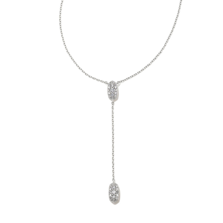 Silver, lariat chain necklace with clear crystals pictured on a white background. 