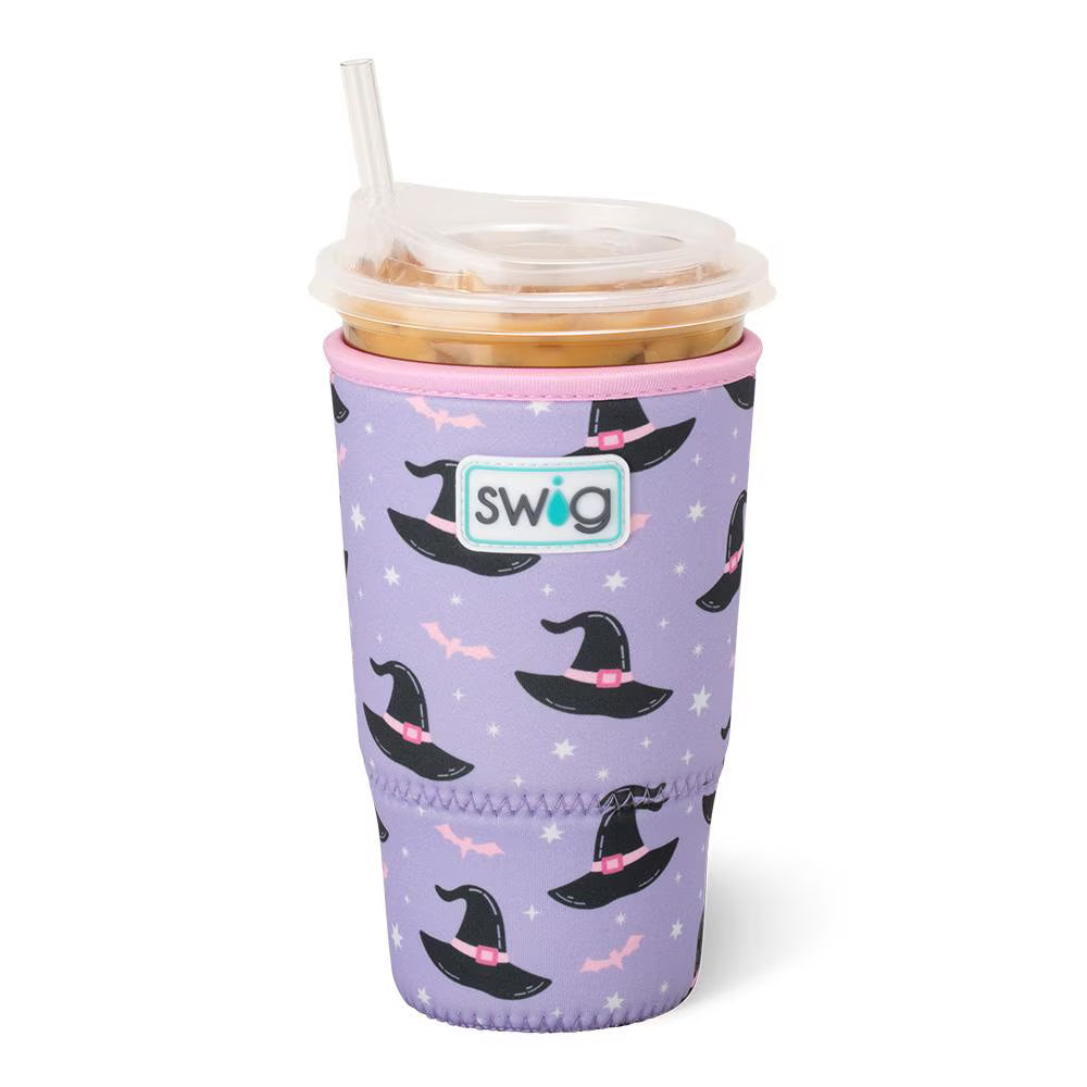 Purple tumbler with witch hat pattern and pink accents, featuring the Swig brand.