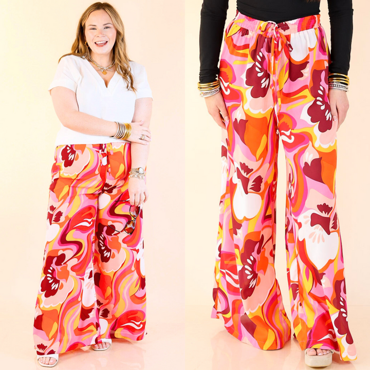 These straight leg pants are made to move, with a stretchy waistband and the fun pink, orange, purple, yellow, and white abstract pattern. Sizes small to large.