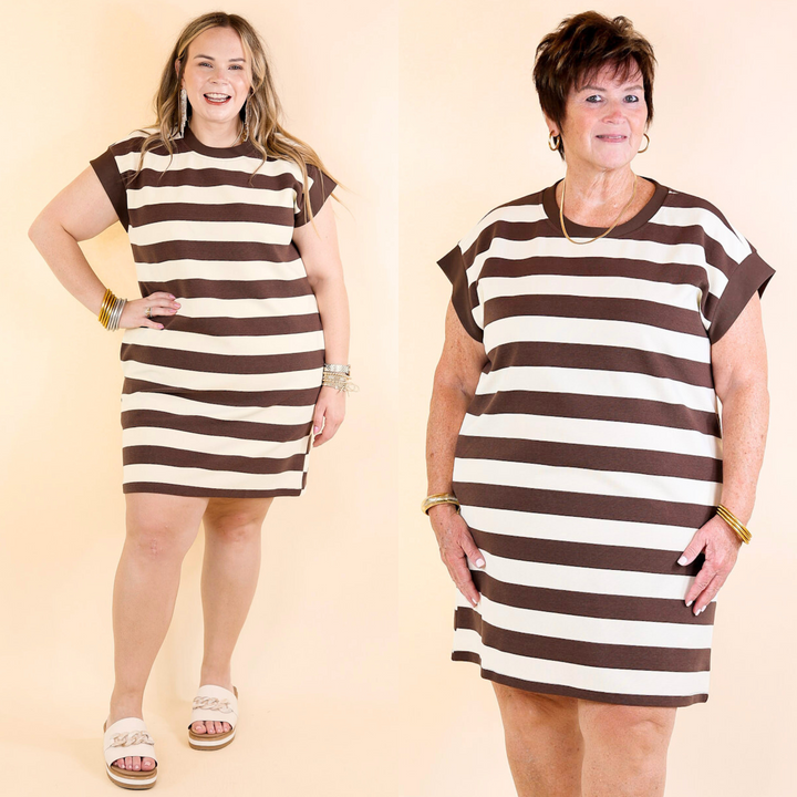 Models wearing striped dress in brown and cream.