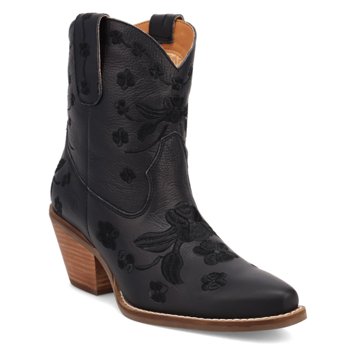 Short black leather western boot with a rounded pointed toe, soft floral embroidery throughout the shaft and foot, stitching, side pull tabs, and a medium 2 inch stacked wooden heel. Feminine and flirty with a vintage cowgirl twist.