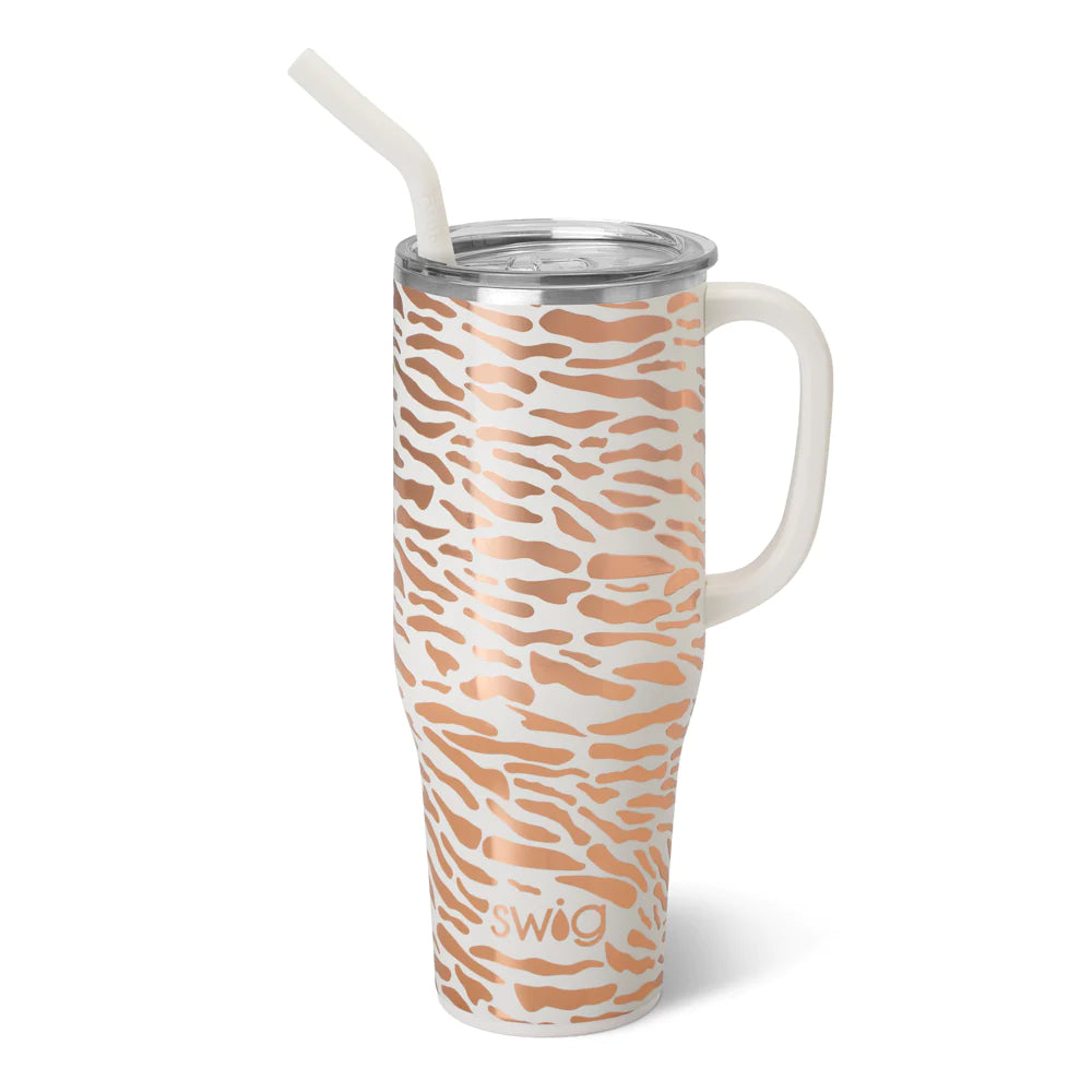 Swig glamazon rose 40 oz mega mug. This cup is white with rose design on top. The cup has a handle and s straw in white. The background of the picture is white.