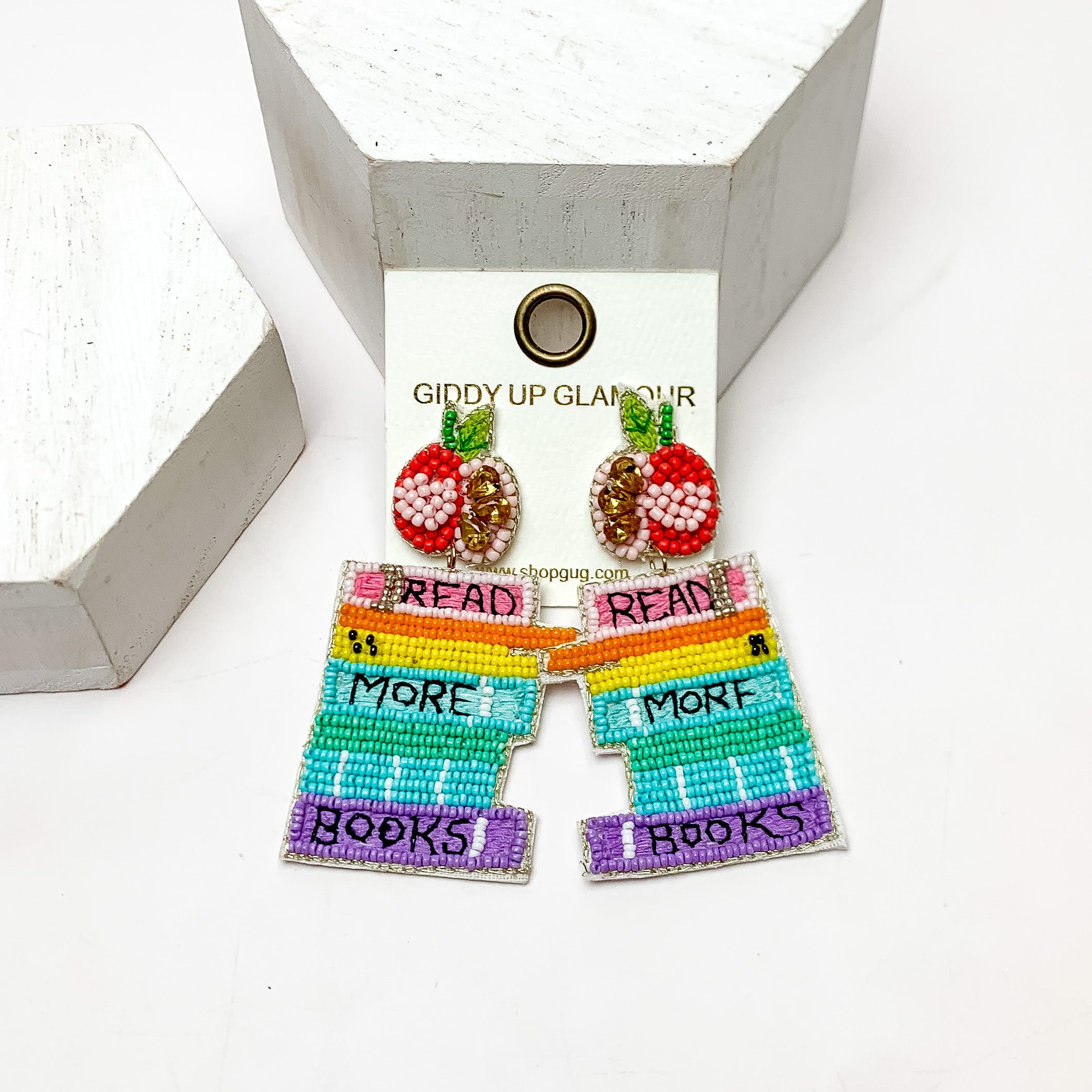 "Read More Books" Multicolor Beaded Earrings With Apple Posts. These earrings are on a white background and have white posts around them.