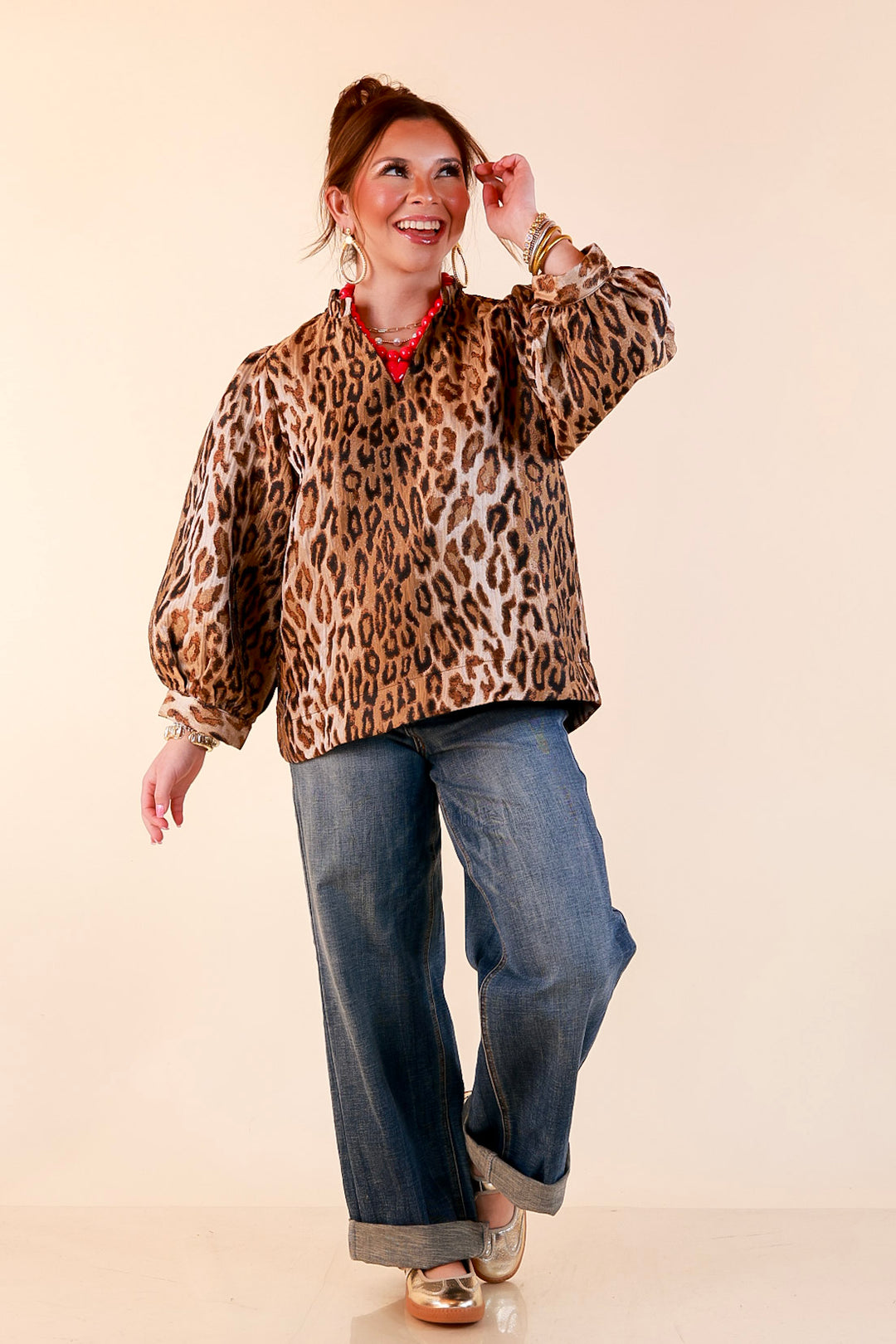 The Golden Hour Leopard Print Jacquard Ruffle Split Neck Balloon Sleeve Top in Gold and Brown
