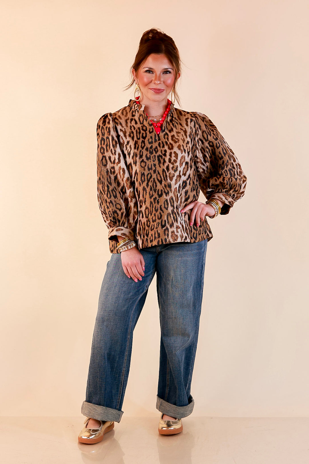 The Golden Hour Leopard Print Jacquard Ruffle Split Neck Balloon Sleeve Top in Gold and Brown