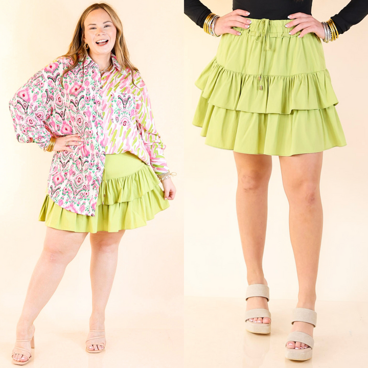This skort includes shorts underneath, a ruffle hemline, and a zip up side. Available in sizes small through large.