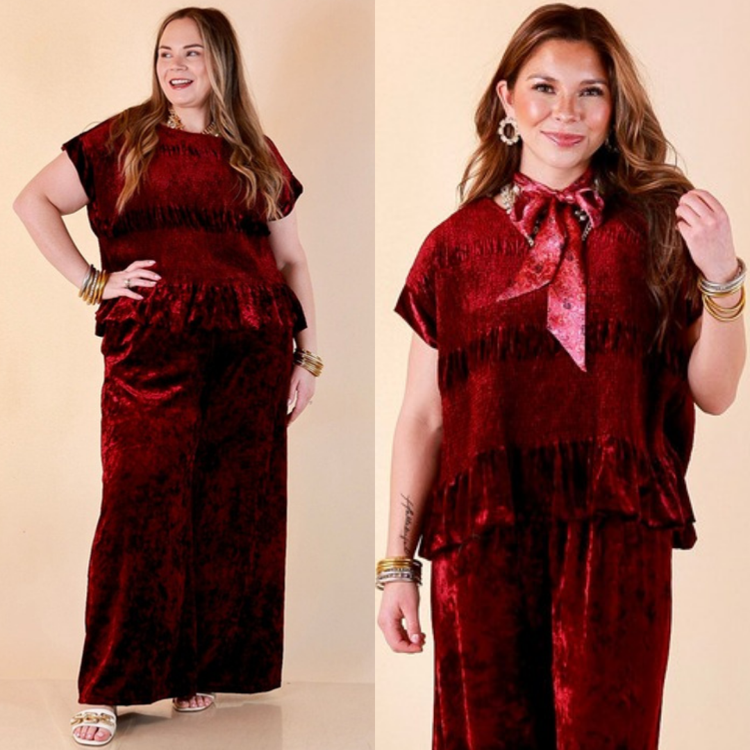 Two images of a woman wearing the Velvet Hour Smocked Crushed Velvet Cap Sleeve Peplum Top in Maroon on a beige background