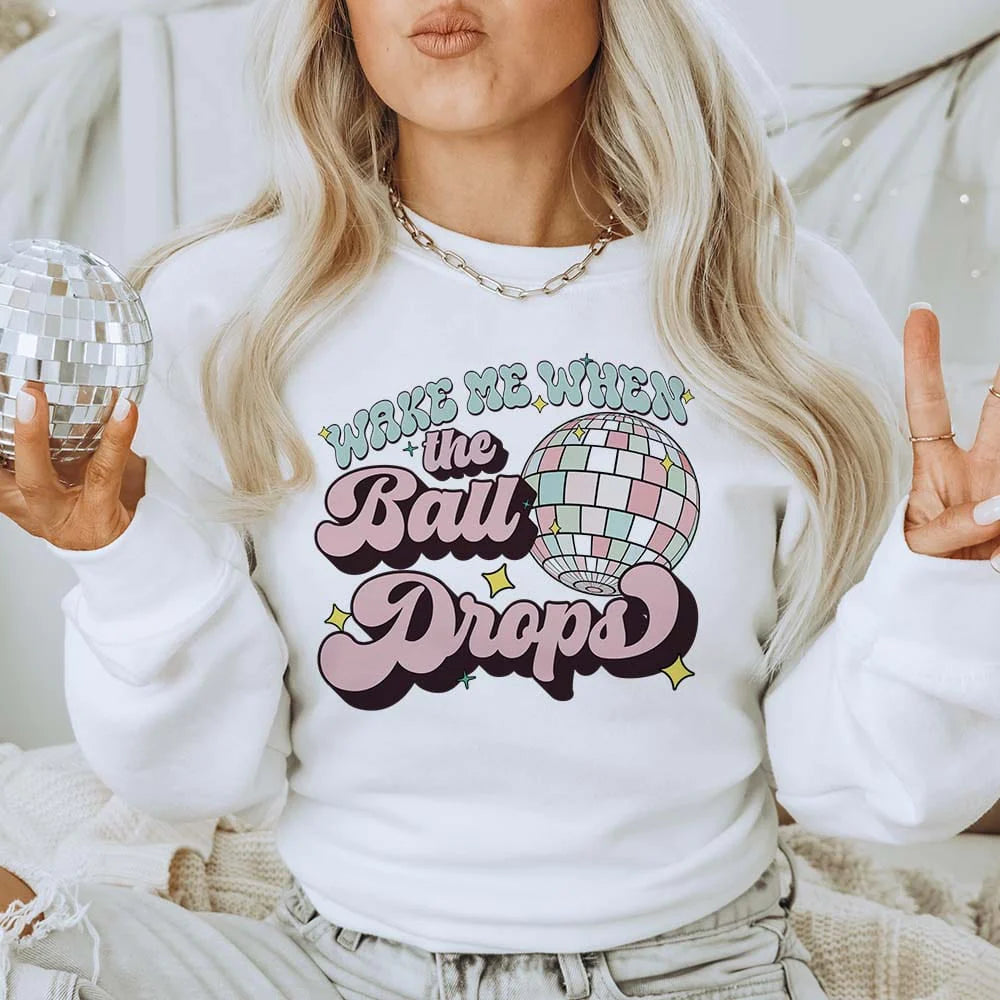 Online Exclusive | Wake Me When The Ball Drops Graphic Sweatshirt in White - Giddy Up Glamour Boutique
