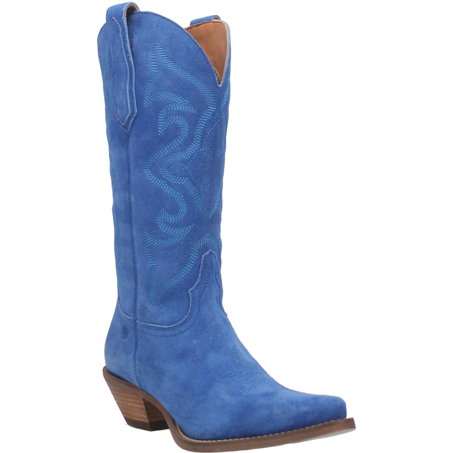 A blue mid calf length suede boot with a unique stitched pattern on the front, matching suede straps, a V cut on the top, and a small heel. Item is pictured on a plain white background