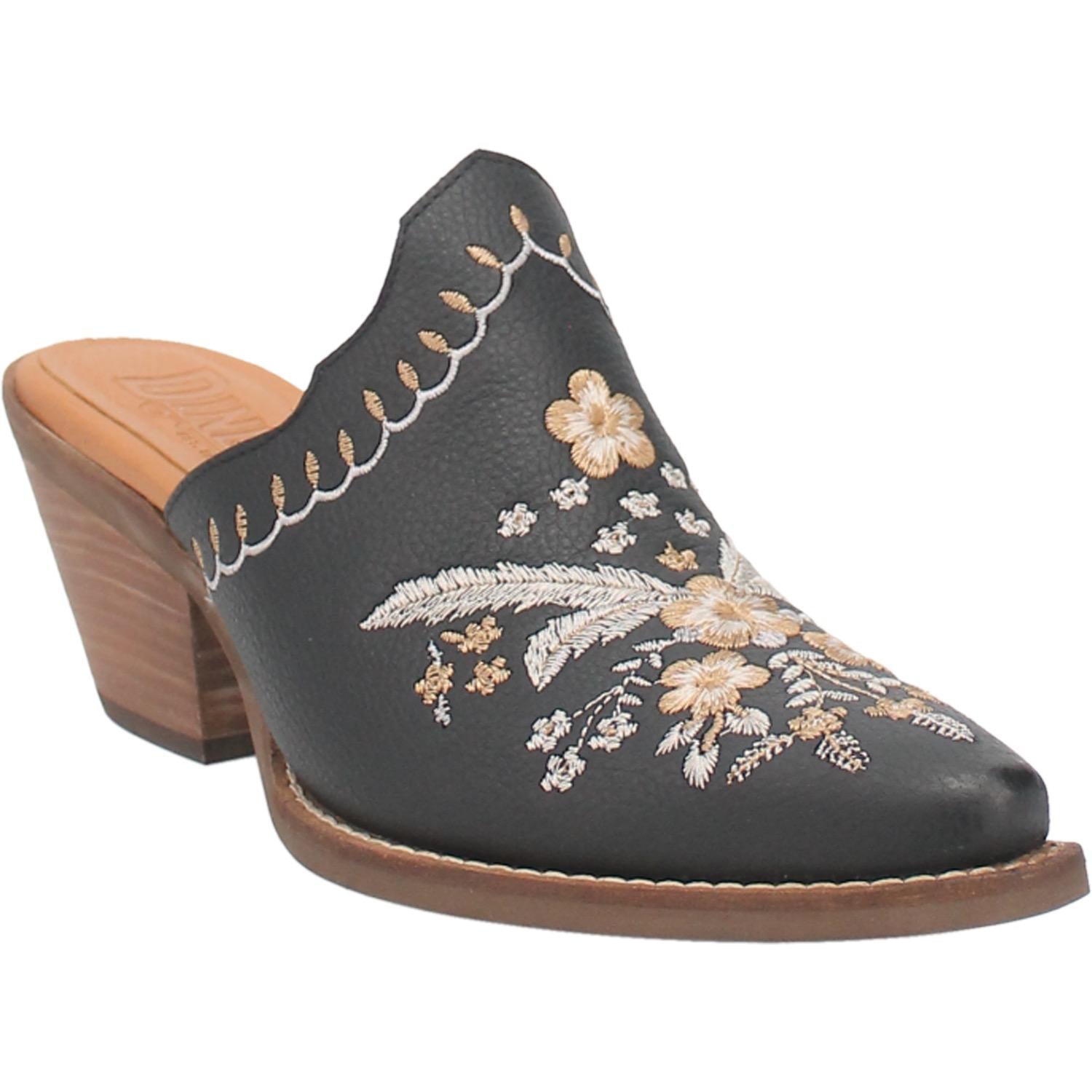 A black bootie with a white and cream floral and feather design on the upper, a white and cream stitched design on the edge, and a short heel