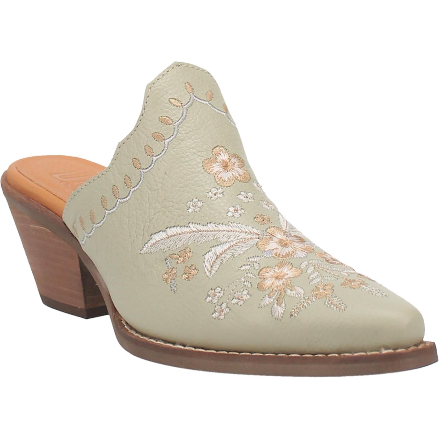 A mint bootie with a white and cream floral and feather design on the upper, a white and cream stitched design on the edge, and a short heel