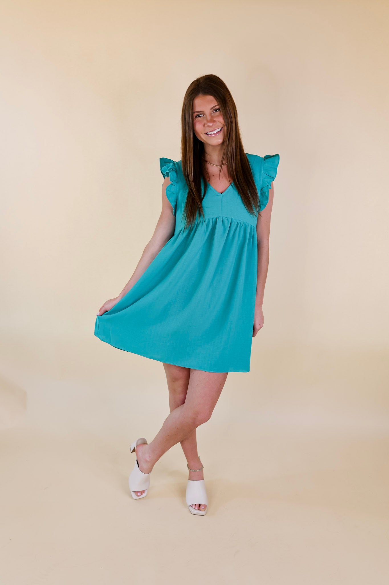 Capture Your Attention V Neck Dress with Ruffle Cap Sleeves in Turquoise - Giddy Up Glamour Boutique
