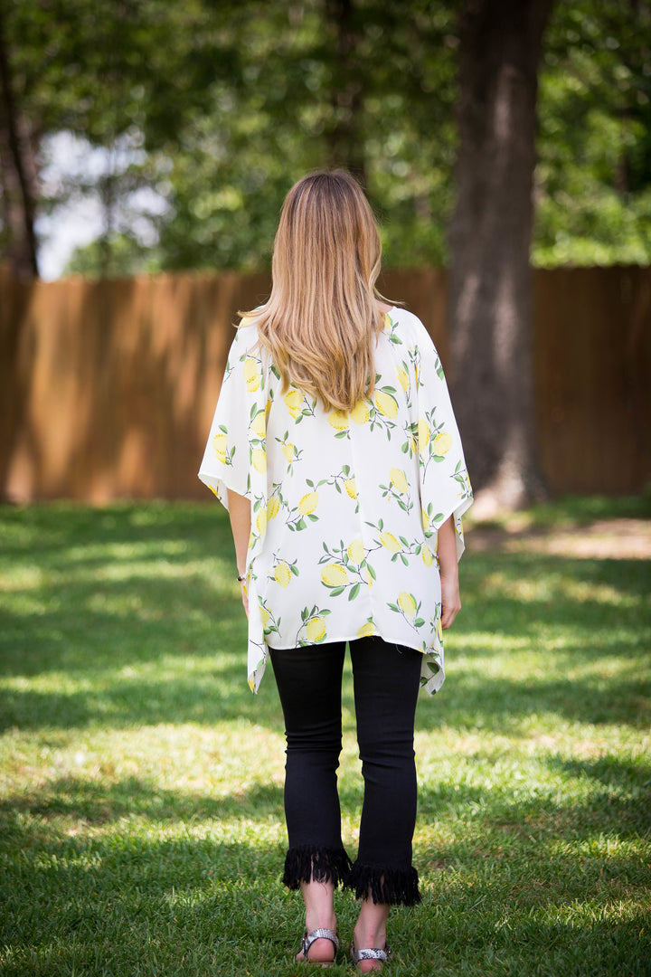This Is Happiness Lemon Print Oversized Poncho Top with Lace Up Detail - Giddy Up Glamour Boutique