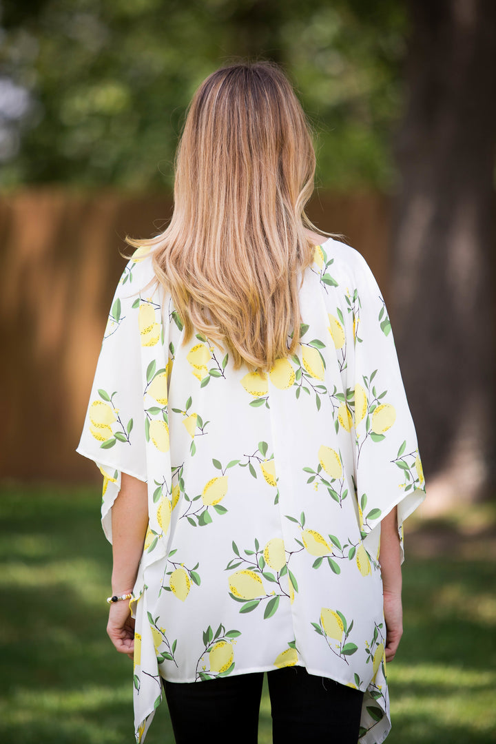 This Is Happiness Lemon Print Oversized Poncho Top with Lace Up Detail - Giddy Up Glamour Boutique