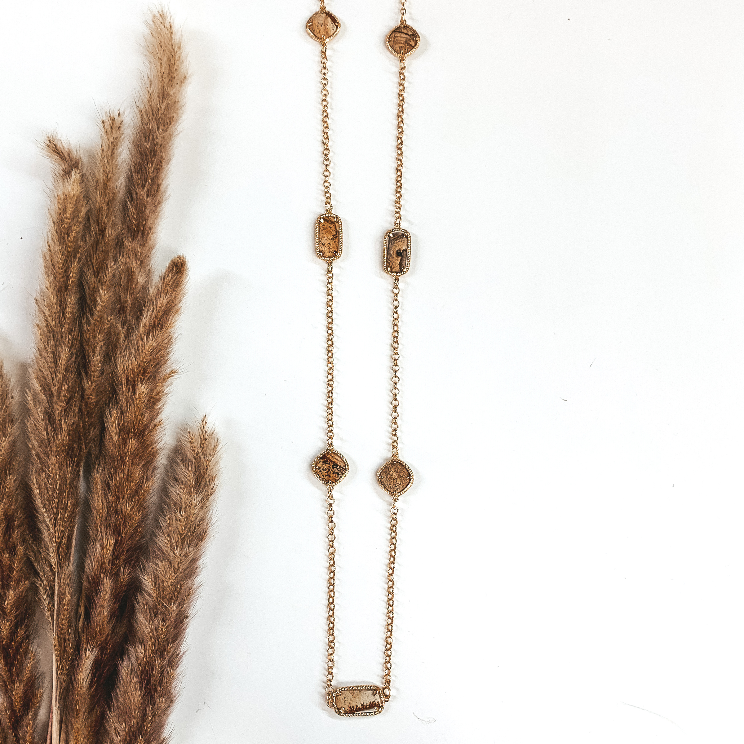 mixed brown stones on a long gold necklace