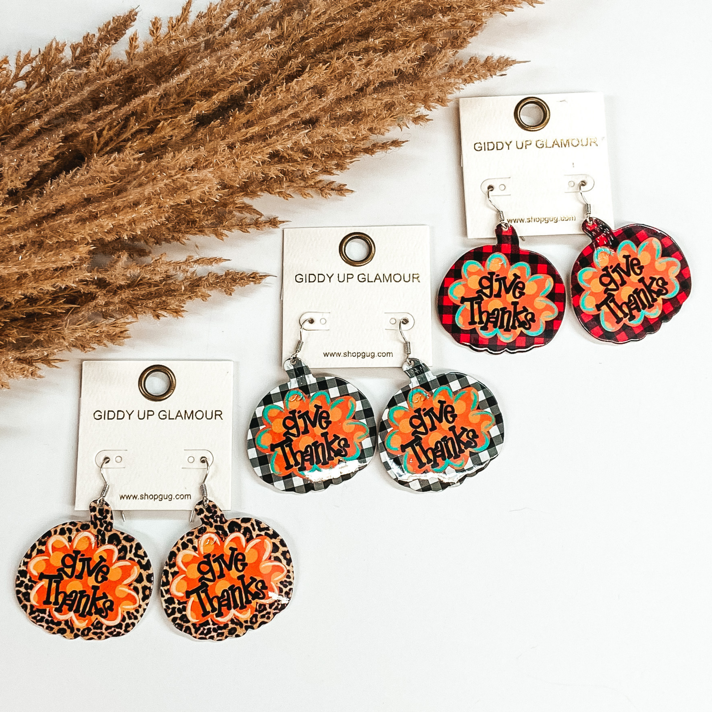 Give Thanks Pumpkin Metal Dangle Earrings in White Buffalo Plaid - Giddy Up Glamour Boutique