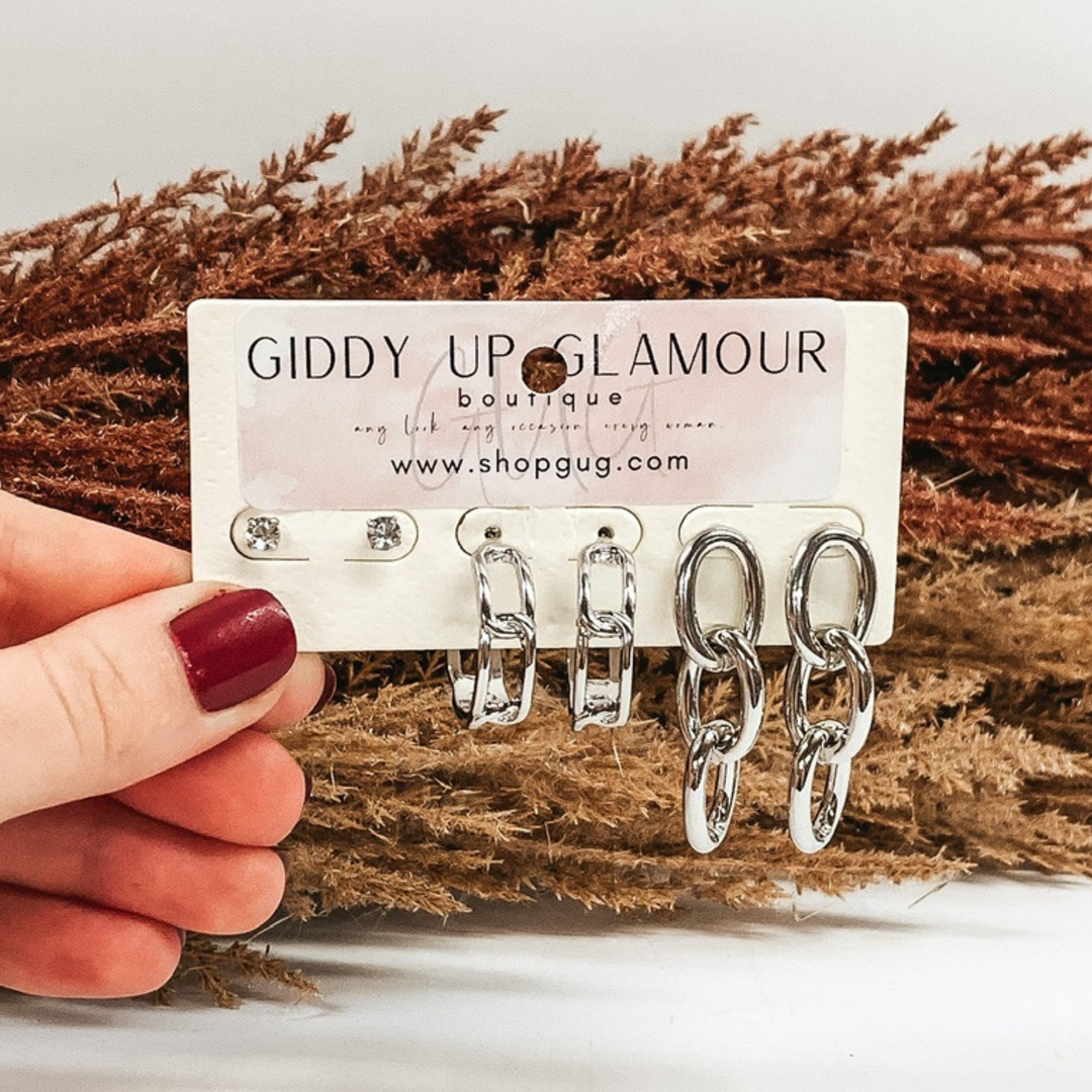 three piece earrings set in silver with studs, hoops, and dangle earrings in silver