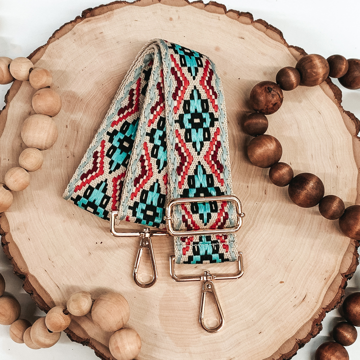 light blue, dusty blue, maroon, coral, and black aztec designed removeable purse strap 