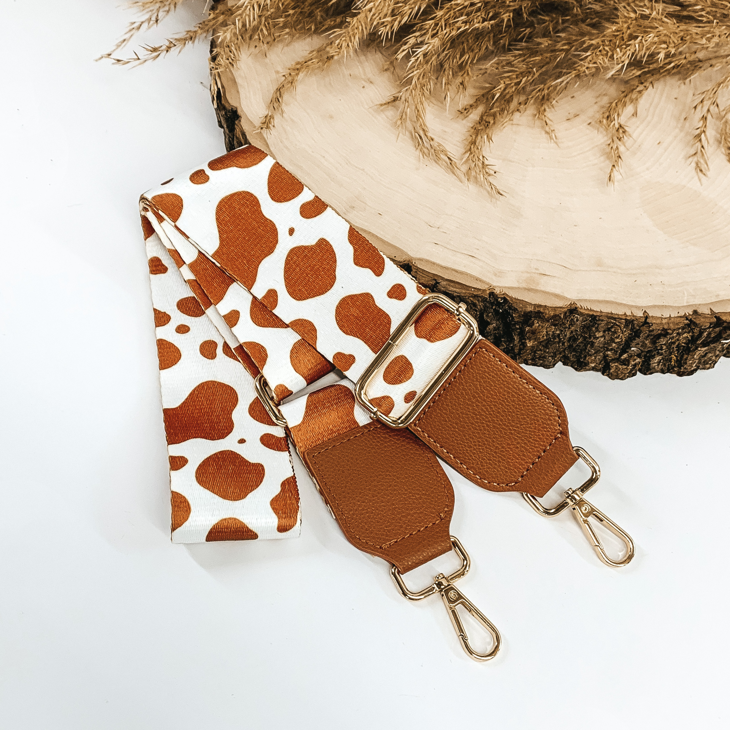 brown and white cow printed removeable purse strap