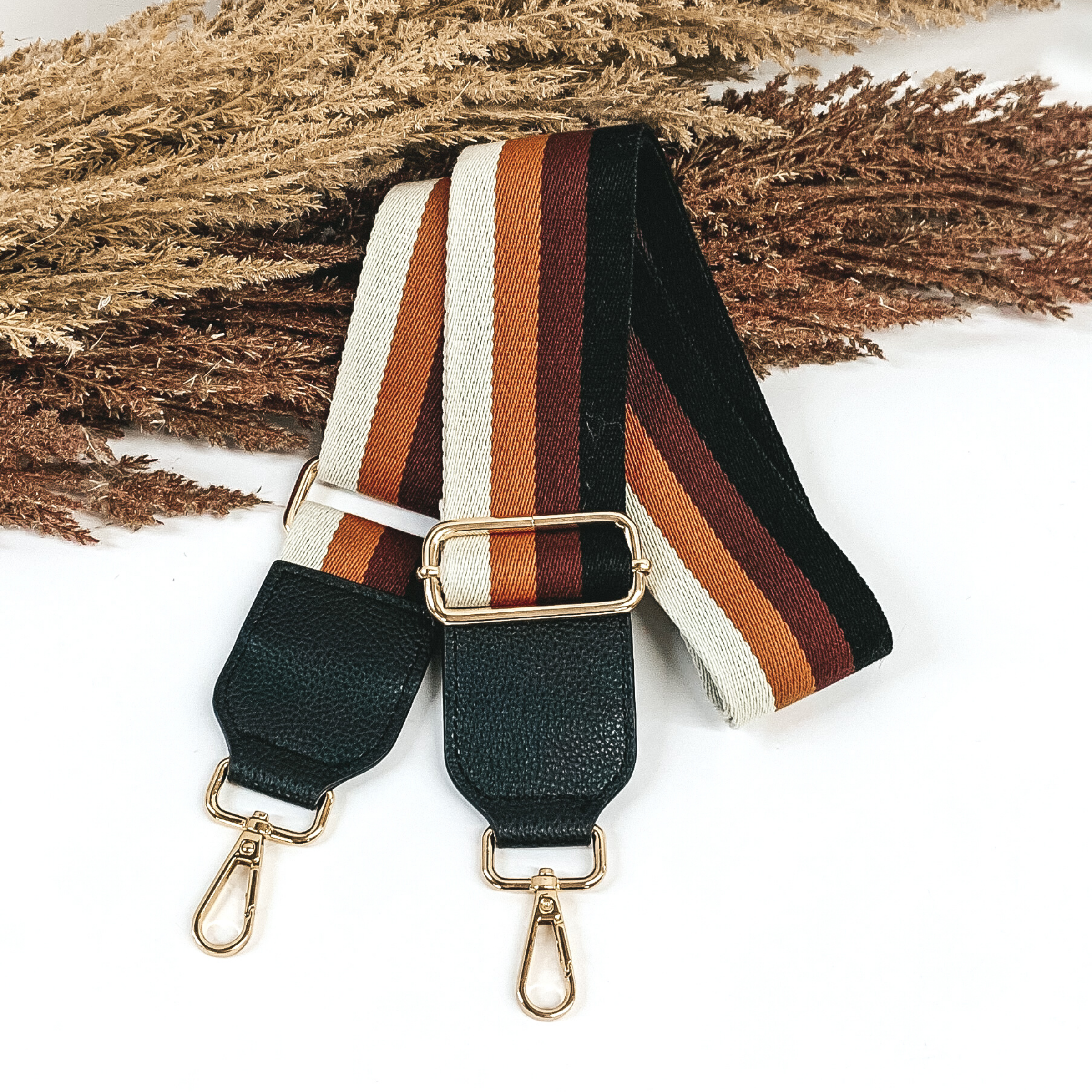 cream, brown, maroon, and black striped removeable purse strap