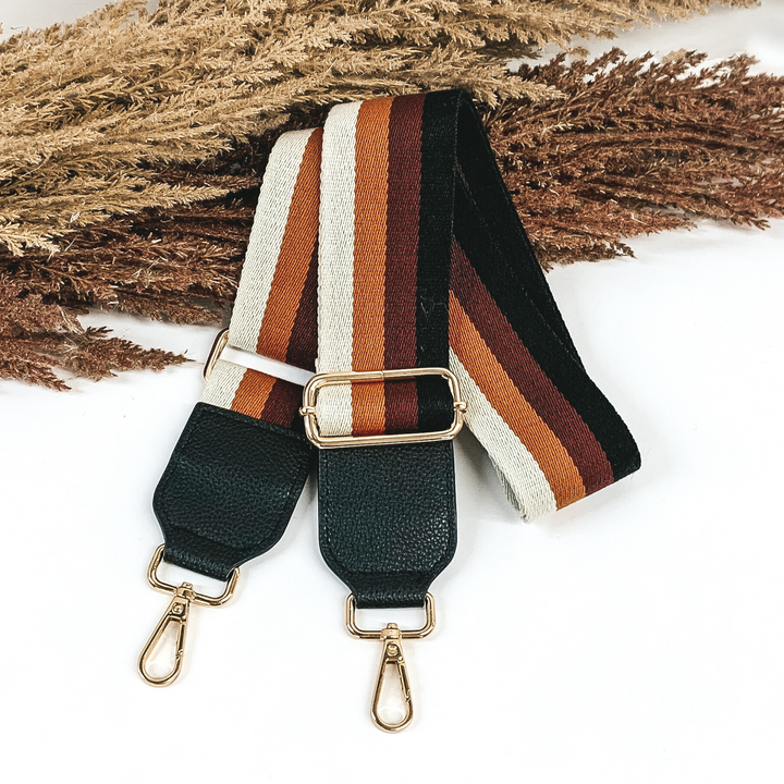 cream, brown, maroon, and black striped removeable purse strap