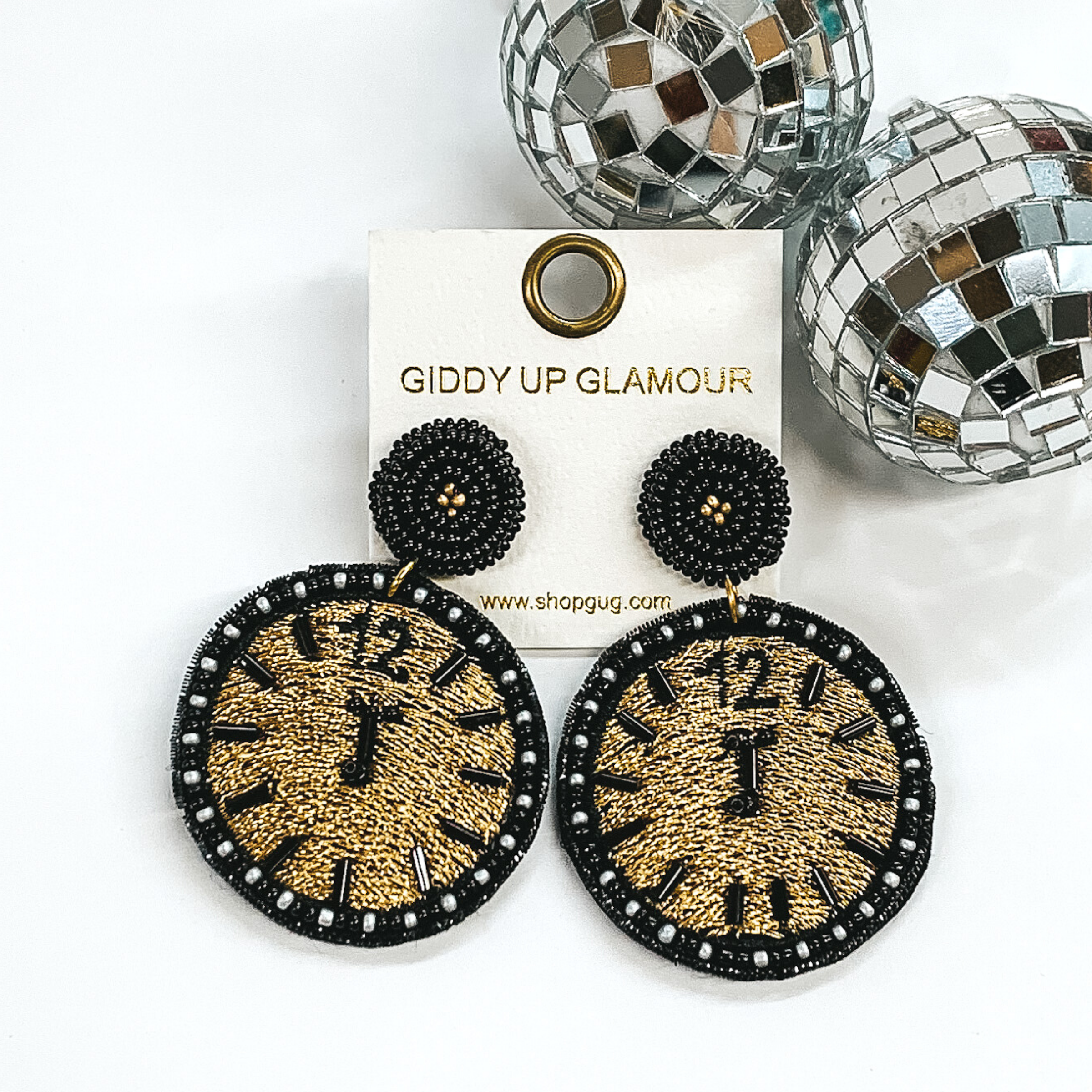 black beaded and gold stitched circle drop earrings  with a clock striking midnight design