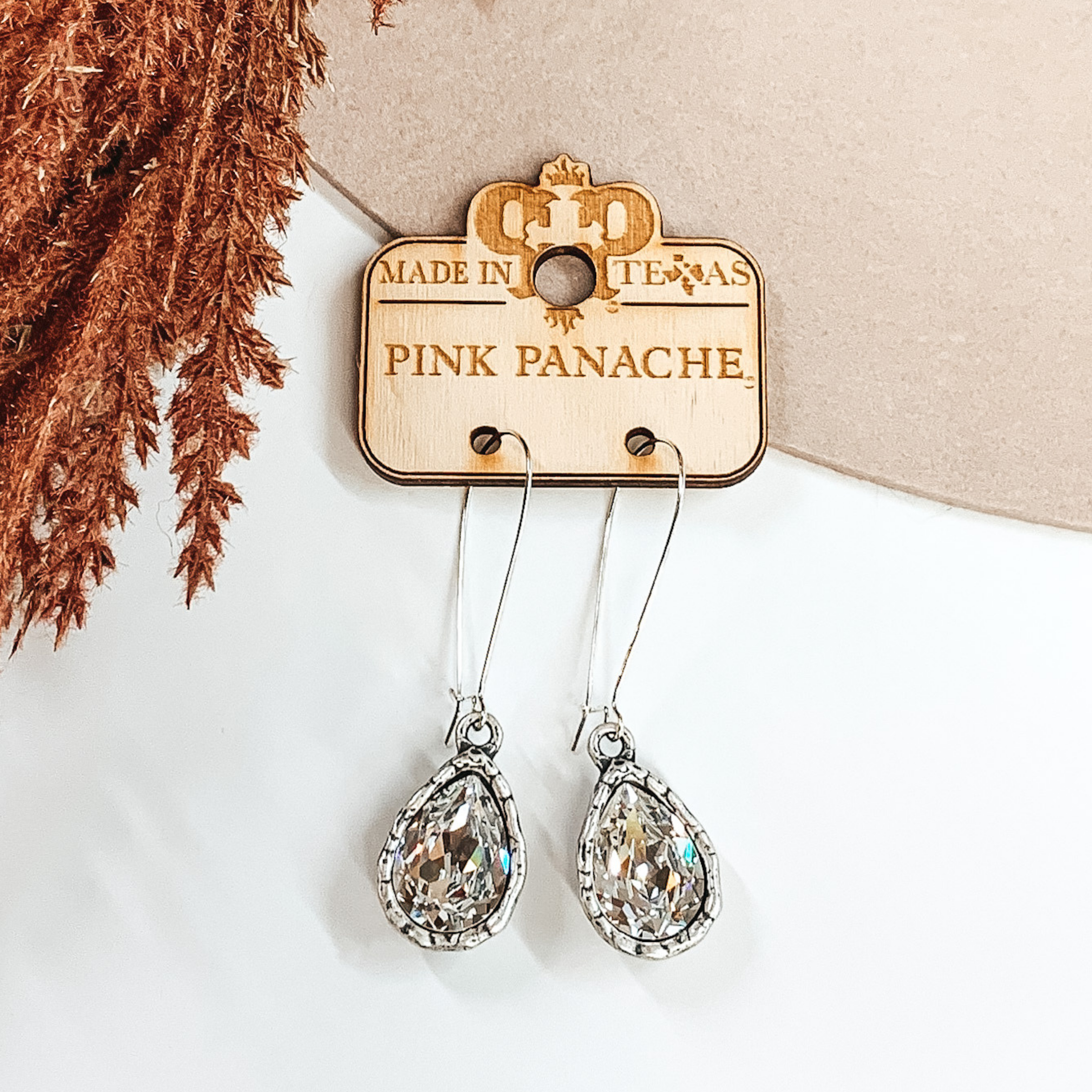 Pink Panache | Silver Kidney Wire Earrings with Clear Pear Teardrop Crystal Charm - Giddy Up Glamour Boutique