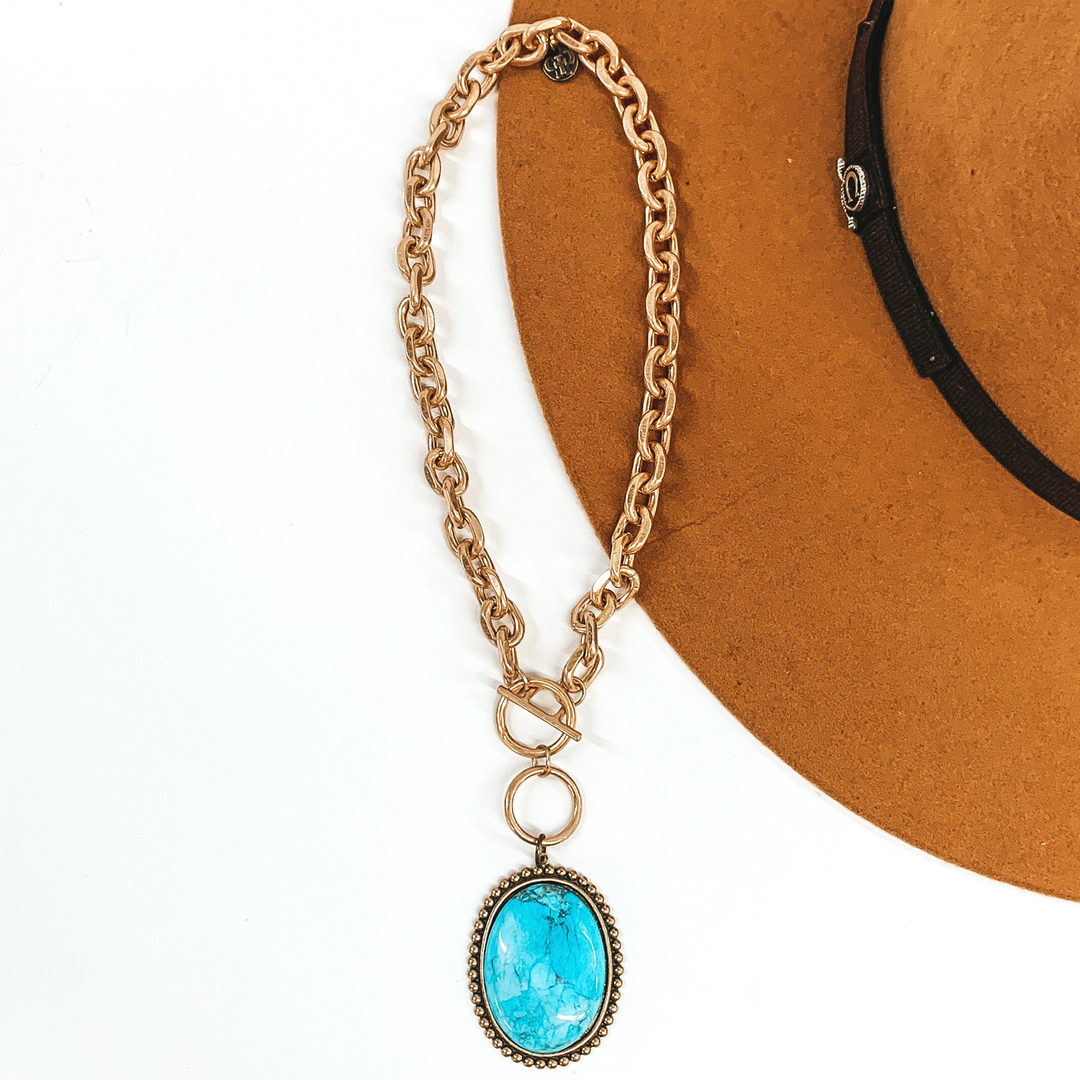 Pink Panache | Large Bronze Oval Turquoise Cabochon Pendant on a Matte Gold Chain Link Necklace with Toggle Front - Giddy Up Glamour Boutique