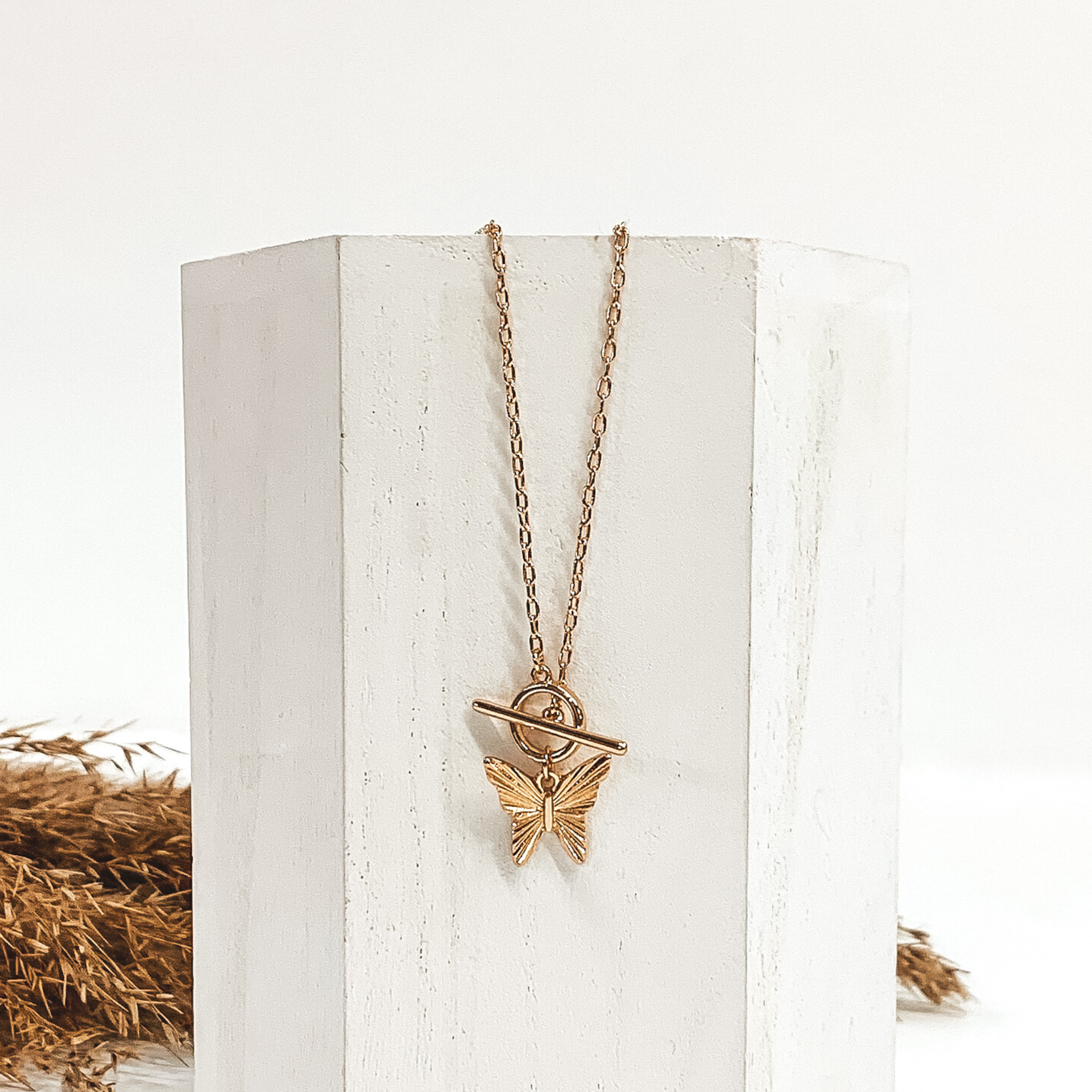 Chain Necklace with a Butterfly Pendant and Toggle Clasp in Gold - Giddy Up Glamour Boutique
